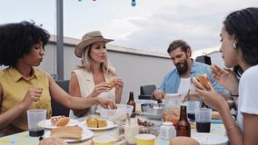 Friends enjoying rooftop barbecue party - Powered by Shutterstock - Get 15% off with code: PIKWIZARD15