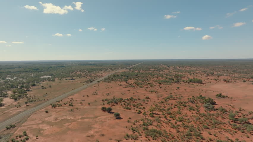 Aerial: Drone shot flying next to Louth road in outback New South Wales, Australia