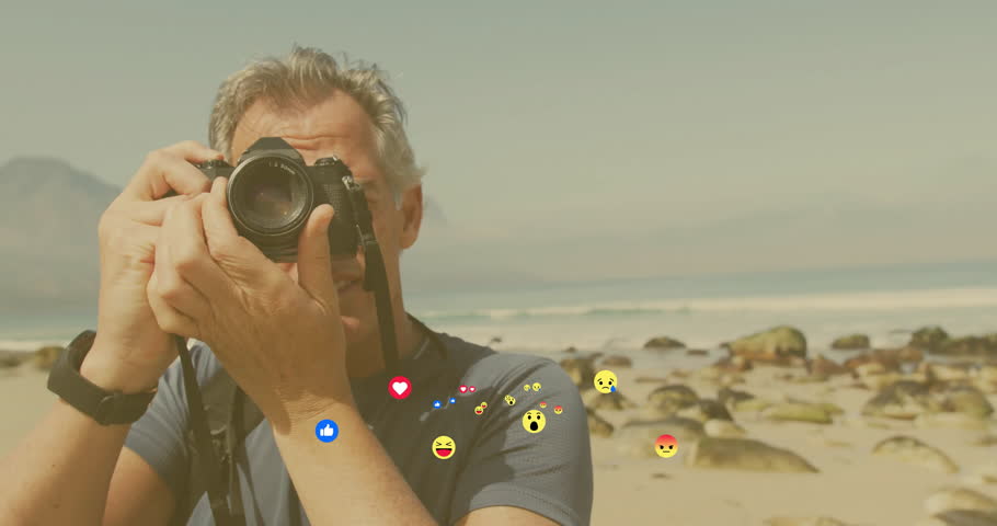 Photographer framing horizon, half-pressing shutter at shore, summoning reaction icons. Landscape, creativity, exploration, serenity, adventure, outdoor, vibrant