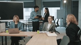 Team collaboration and document review in a modern office setting with slow motion effects - Powered by Shutterstock - Get 15% off with code: PIKWIZARD15