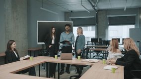 Engaged team collaborates in modern office space during productive meeting while sharing ideas and discussing documents - Powered by Shutterstock - Get 15% off with code: PIKWIZARD15