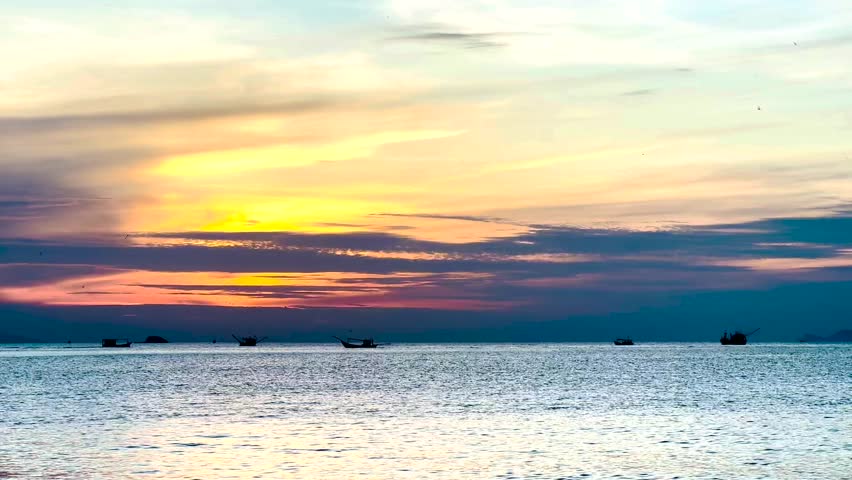A new day with sunrise on the sea and boats, Nha Trang, Viet Nam