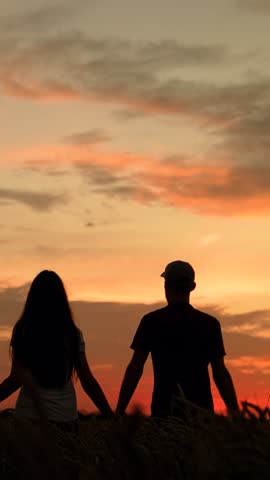 Business people farmer team man woman holding hands walking through wheat field. People working in team. Group man woman working in team in agriculture, partnership. Business people united by one idea
