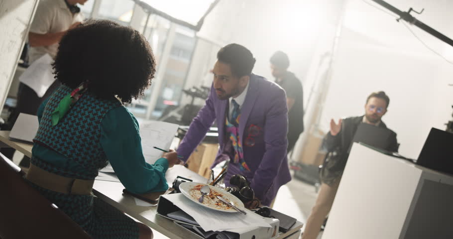 Acting, movie production and people with videography, set and creativity with expression. Group, actors and professional with camera equipment, entertainment and behind the scenes and filmmaking