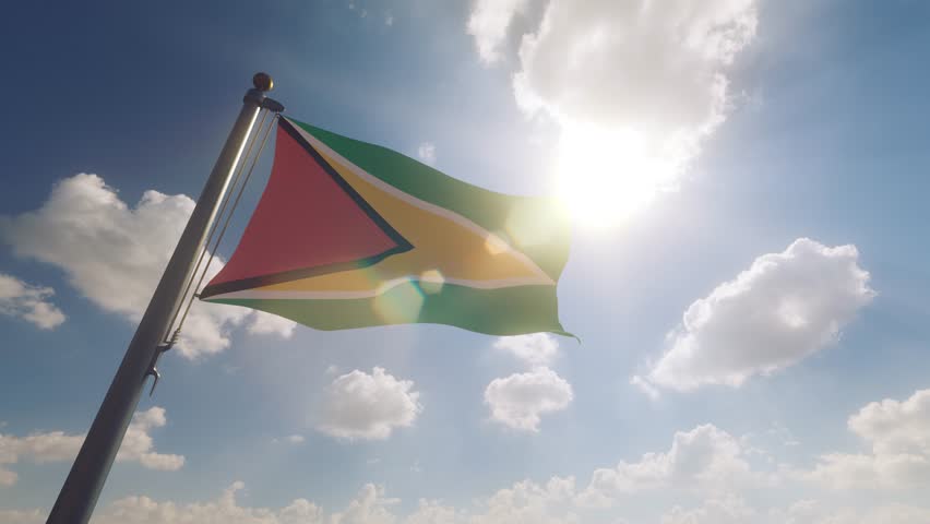 Guyana Flag on a Flagpole with a cloudy blue sky background