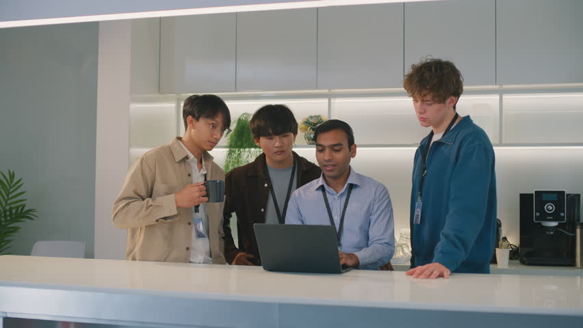 Young people in co-working creative space, Young co-workers team talking during startup - Happy people planning project millennial generation and business concept Indian man in a diverse team