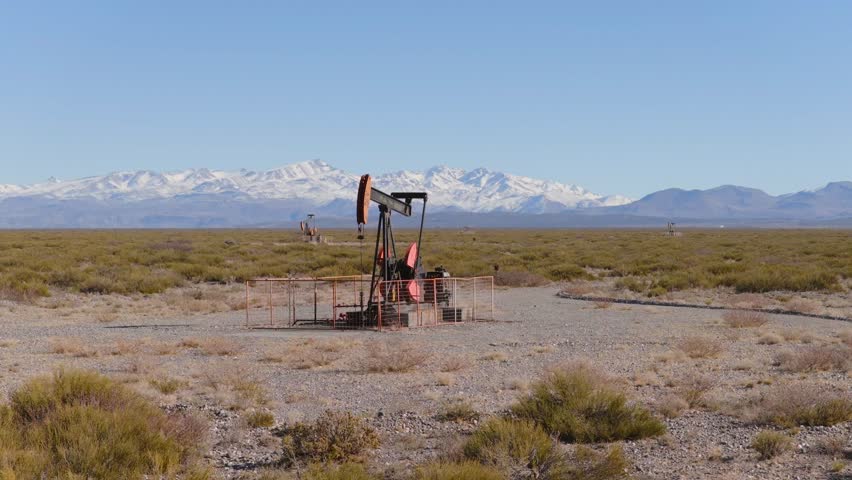 Oil pump operating in Patagonian plains, Resource exploitation and development, Argentina