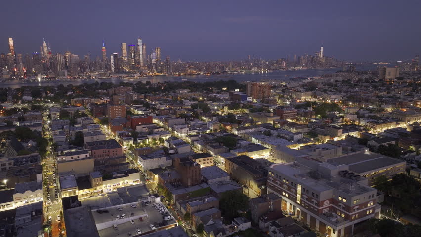 Aerial view of Union City, New Jersey at night. Shot with the New York City skyline in the background.