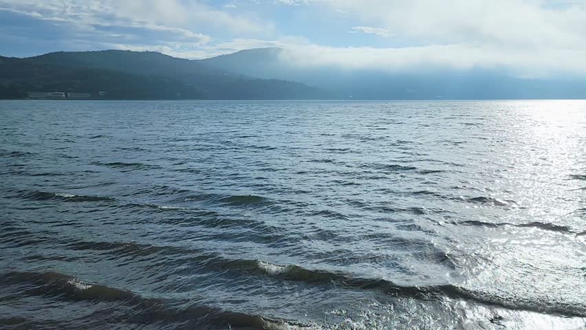 Wind currents blow water waves