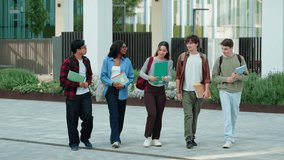 Group of college students talking and walking out of University campus - Young friends  - Powered by Shutterstock - Get 15% off with code: PIKWIZARD15