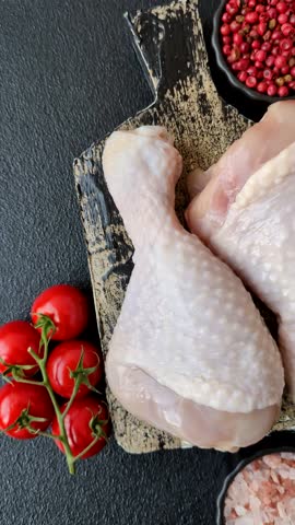 Raw chicken legs, fresh uncooked poultry meat. Chicken or turkey legs with salt and spices