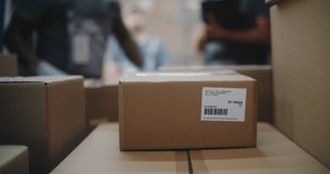 Multiethnic Workers Unloading Cardboard Boxes with Online Orders, E-Commerce Goods from Delivery Truck. Manager Using Tablet Computer and Barcode Scanner. Outside of Logistics Distribution Warehouse. - Powered by Shutterstock - Get 15% off with code: PIKWIZARD15