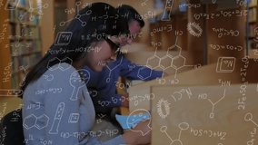 Hispanic student typing on laptop, tutor pointing at screen amid chemistry formulas for research. Collaboration, research, innovation, education, science, academic, mentorship - Powered by Shutterstock - Get 15% off with code: PIKWIZARD15