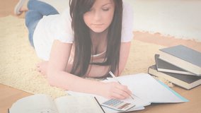 Student pressing calculator and activating animated bar chart overlay during study session. Learning, concentration, academia, data analysis, visualization, motivation, intelligence - Powered by Shutterstock - Get 15% off with code: PIKWIZARD15