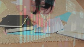 Woman lying on rug writing pressing calculator and initiating overlaid charts for budget planning. Financial planning, home workspace, casual lifestyle, personal finance, productivity, budget - Powered by Shutterstock - Get 15% off with code: PIKWIZARD15