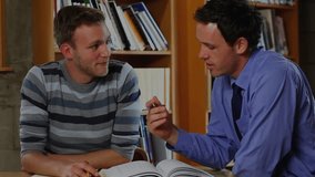 Mentor flipping book explaining code while student jotting notes as tech overlay signaling shift. Educator, apprentice, archival, innovation, mentorship, concentration, collaboration - Powered by Shutterstock - Get 15% off with code: PIKWIZARD15