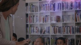 Teacher opening tablet and tapping screen to engage students with expanding holographic network. Education, technology, innovation, classroom, collaboration, digital, learning - Powered by Shutterstock - Get 15% off with code: PIKWIZARD15