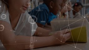 Camera panning across students reading at library while network graphics overlay showing education. Learning, literacy, education, digital, technology, collaboration, focus - Powered by Shutterstock - Get 15% off with code: PIKWIZARD15