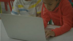 Two boys opening laptop and typing, code fragments spreading over screens during coding lesson. Children, education, technology, teamwork, innovation, learning, youthful - Powered by Shutterstock - Get 15% off with code: PIKWIZARD15