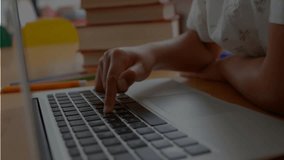Boy tapping trackpad dragging and typing on laptop showing floating letters, numbers for studying. Education, technology, learning, digital, concentration, curiosity, creativity - Powered by Shutterstock - Get 15% off with code: PIKWIZARD15