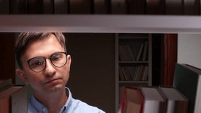 Librarian counting money hidden among library bookshelves - Powered by Shutterstock - Get 15% off with code: PIKWIZARD15