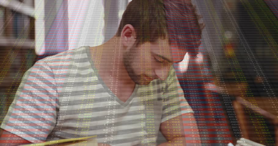 Male student reaching and opening finance book tracing text making notes with data overlay drifting. Introspection, concentration, learning, study, focus, analysis, typography