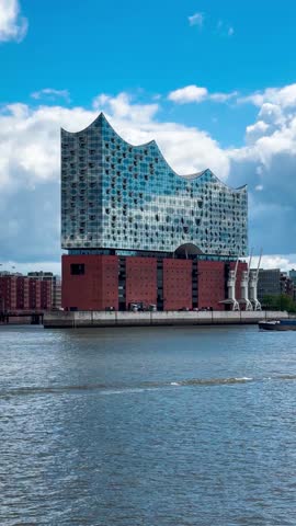 Elbphilharmonie, ships and cityscape riverfront of Hamburg, Germany May 19, 2025. High quality 4k footage