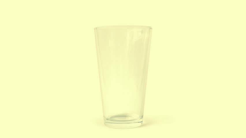 Orange Juice Is Poured Into Glass
