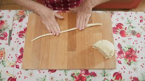 Man in Kitchen Preparing Traditional Italian Pasta  - Powered by Shutterstock - Get 15% off with code: PIKWIZARD15