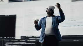 African American programmer engaging in virtual reality with a headset, focusing on system development. Utilizing code on terminal window to debug and design new software. IT career. Camera B. - Powered by Shutterstock - Get 15% off with code: PIKWIZARD15