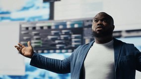 Black professional software engineer programming for tech innovation, reviewing data and binary code on the dashboard. IT specialist examining programming language for transformation. Camera B. - Powered by Shutterstock - Get 15% off with code: PIKWIZARD15