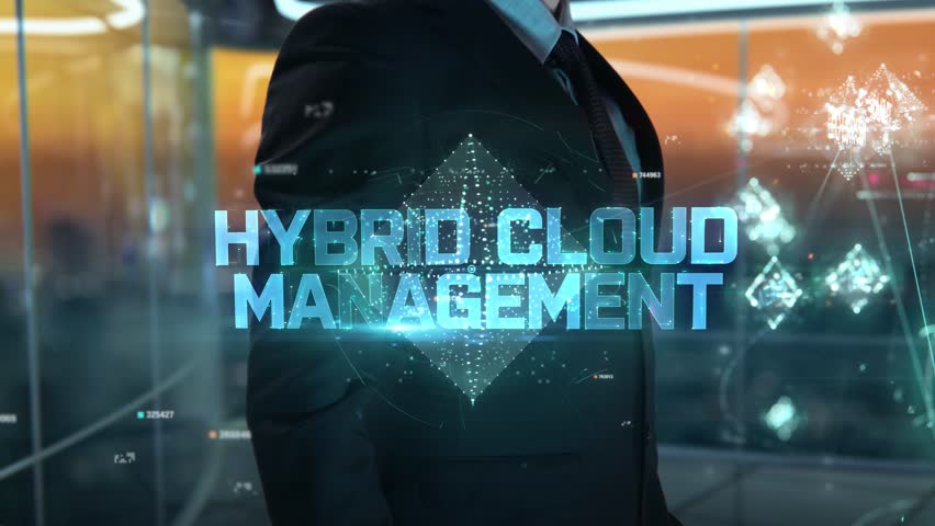 Businessman with Hybrid cloud management hologram concept