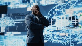 African American businessman studying digital AI brain interface, symbolizing neural networks, data science and algorithmic thinking. Cybernetics for a high tech futuristic innovation. Camera B. - Powered by Shutterstock - Get 15% off with code: PIKWIZARD15