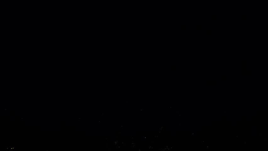 4K. loop seamless of real fireworks background golden shining fireworks with bokeh lights in the night sky. glowing fireworks show. New year