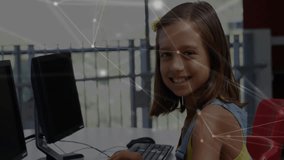 Student practicing coding initiating digital network overlay then pausing and smiling at camera. Educational, technology, innovation, studio, children, futurism, curiosity - Powered by Shutterstock - Get 15% off with code: PIKWIZARD15