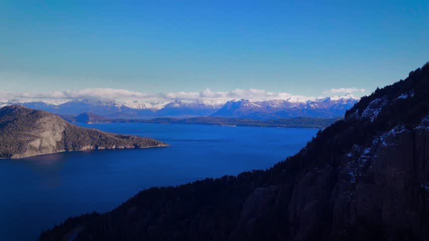 Breathtaking aerial view of Nahuel Huapi Lake from the Huemul area near Villa La Angostura, with Cerro Centinela rising to the side. Captured in the Argentine Patagonia, this scenic landscape showcase