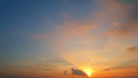 Golden sunrise time-lapse blooms softly across the sky, blending pastel oranges and pinks with calm blue. Clouds drift gently, glowing warmly as dawn’s light awakens a new day’s promise. Timelapse.
 - Powered by Shutterstock - Get 15% off with code: PIKWIZARD15