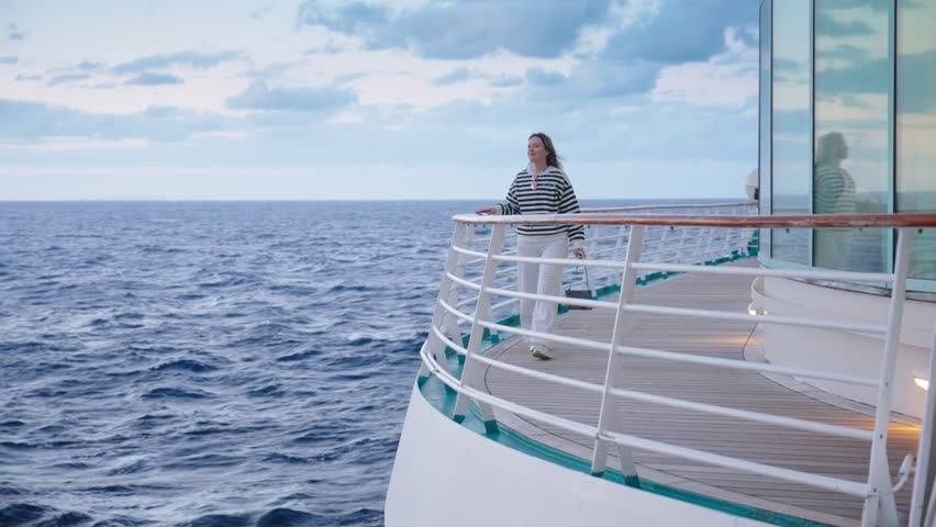 A woman discovers great joy aboard an incredibly luxurious cruise ship, surrounded by breathtaking ocean views and serene, beautiful skies that create a perfect escape from everyday life