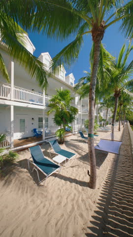 Vertical Screen: Explore the beautiful beachfront resorts of Key West, Florida, where palm trees and sandy shores offer a perfect setting for relaxation and exciting adventures