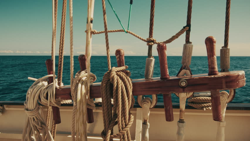 Big sailing boat moves in the open sea. Deck details of a sailing vessel