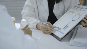 Medical research team collaborating, analyzing scientific data, discussing pharmaceutical research findings on laboratory workstation - Powered by Shutterstock - Get 15% off with code: PIKWIZARD15