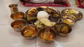 Special Bengali thali served in rice ceremony event which includes different variety of fishes, rice, lentils, sweets, and fry potatos and curd - Powered by Shutterstock - Get 15% off with code: PIKWIZARD15