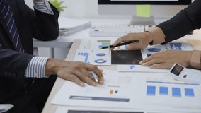 Professional business team analyzing financial data, working collaboratively on growth strategy and market research in contemporary corporate workspace - Powered by Shutterstock - Get 15% off with code: PIKWIZARD15