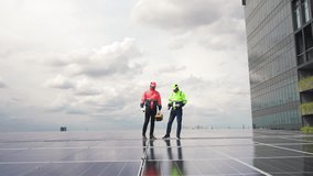 Professional Engineering Man and Electrician Installing Rooftop Solar Panel and Inspecting Electric System on Industrial Building Roof for Renewable Energy - Powered by Shutterstock - Get 15% off with code: PIKWIZARD15