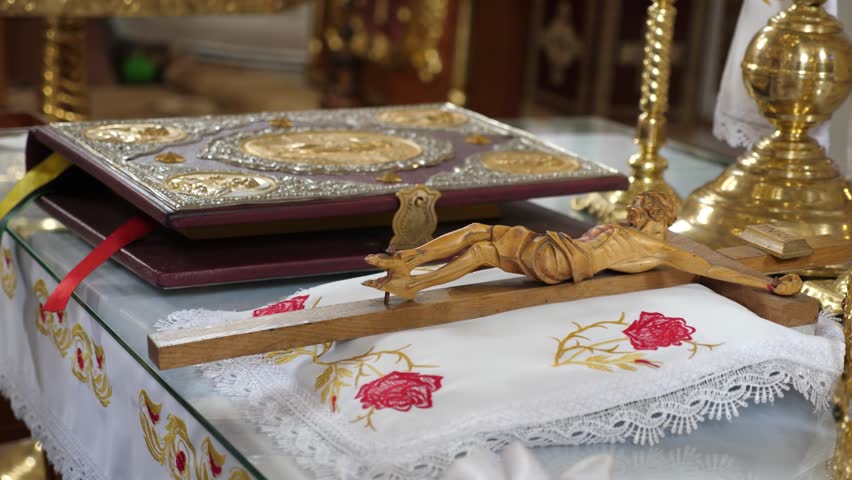 A large Gospel with a metal cover and clasps on the altar in the church.