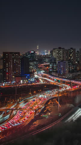 The flow of urban subway traffic and buildings in Beijing, China at night