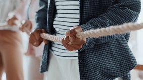 Pull rope, teamwork and hands for competition, game and challenge with business people in office. Group, tug of war and cooperation with strength, power and collaboration with synergy for contest - Powered by Shutterstock - Get 15% off with code: PIKWIZARD15