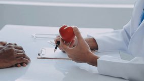 Young doctor is using a stethoscope listen to the heartbeat of the patient. Shot of a female doctor giving a male patient a check up Video - Powered by Shutterstock - Get 15% off with code: PIKWIZARD15