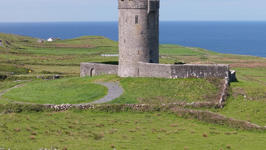 Round stone tower of Doonagore Castle near Doolin County Clare Ireland sunny coast