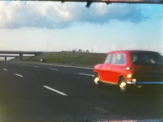 Rare historical vintage amateur cine film footage of a typical British motorway taken back in the 70's showing the M1 uk motorway from 1974 with historical cars on the road